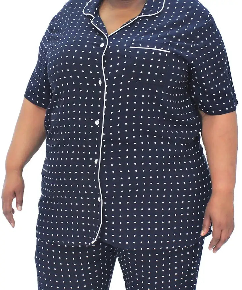 Navy blue polka dot pajama set featuring short sleeves and piping trim for women