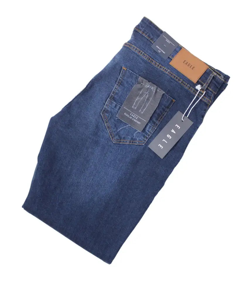 Folded Mens Nebraska Eagle jeans with tags, showcasing stylish blue denim